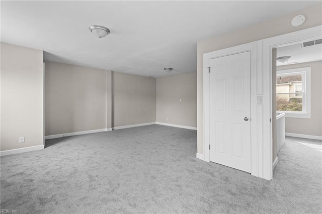 interior space featuring carpet, visible vents, and baseboards