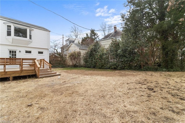 view of yard with a wooden deck