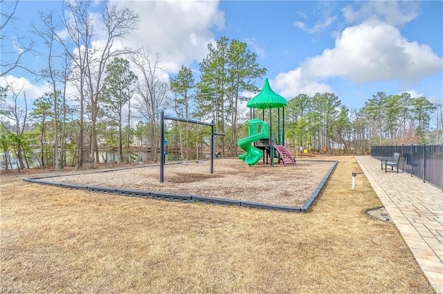 communal playground featuring fence