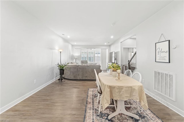 dining space with recessed lighting, visible vents, stairway, wood finished floors, and baseboards