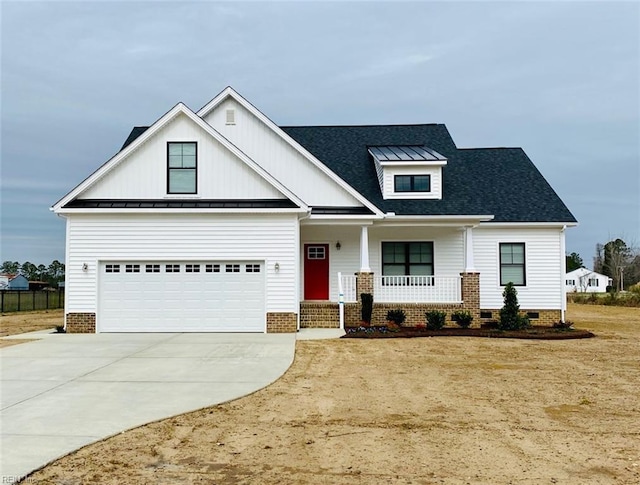 modern farmhouse featuring a porch, concrete driveway, crawl space, a standing seam roof, and metal roof