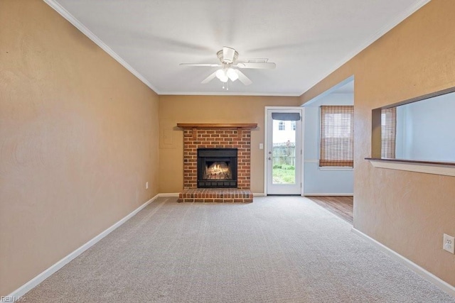 unfurnished living room featuring carpet, baseboards, a fireplace, and ornamental molding