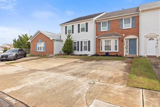 view of front of house featuring brick siding