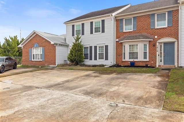 view of front of house with brick siding