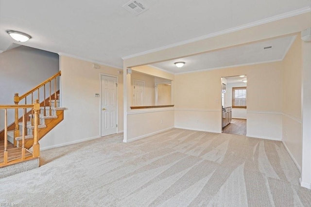 empty room with carpet floors, stairway, visible vents, and baseboards