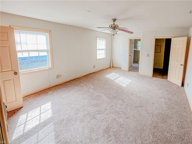 unfurnished bedroom featuring carpet flooring, a ceiling fan, and baseboards