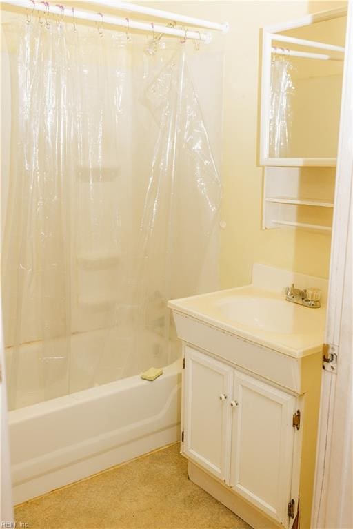 bathroom with shower / bath combo with shower curtain and vanity