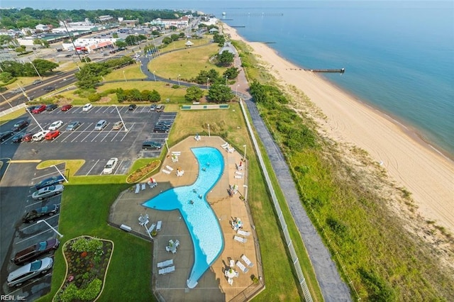 aerial view with a water view and a view of the beach