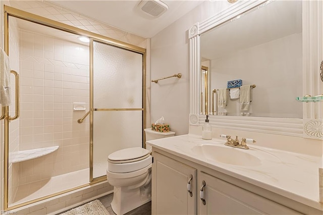 bathroom featuring a stall shower, visible vents, vanity, and toilet