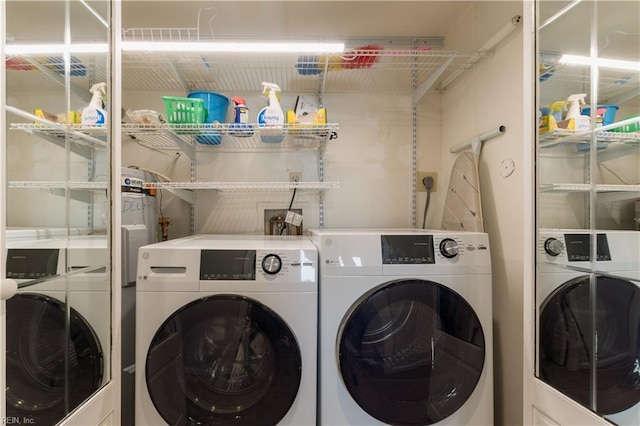 laundry room with laundry area and washer and clothes dryer