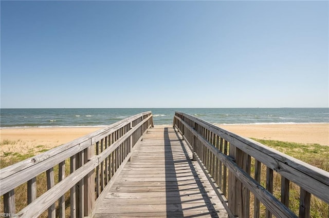 view of home's community featuring a view of the beach and a water view