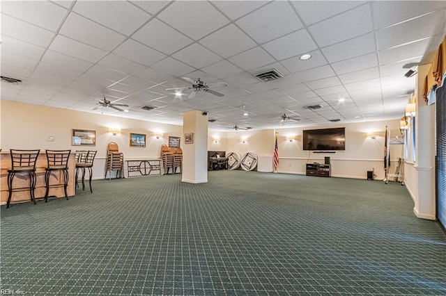 workout area featuring carpet, visible vents, and a ceiling fan