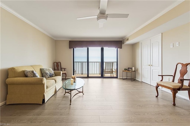 living room with baseboards, visible vents, ceiling fan, ornamental molding, and wood finished floors