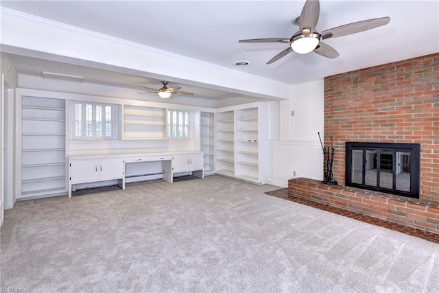 unfurnished living room with light carpet, a fireplace, and visible vents