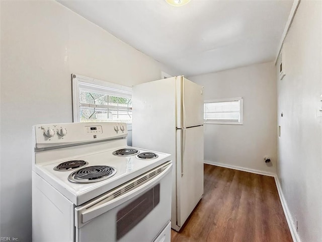 kitchen featuring white electric stove, wood finished floors, and baseboards