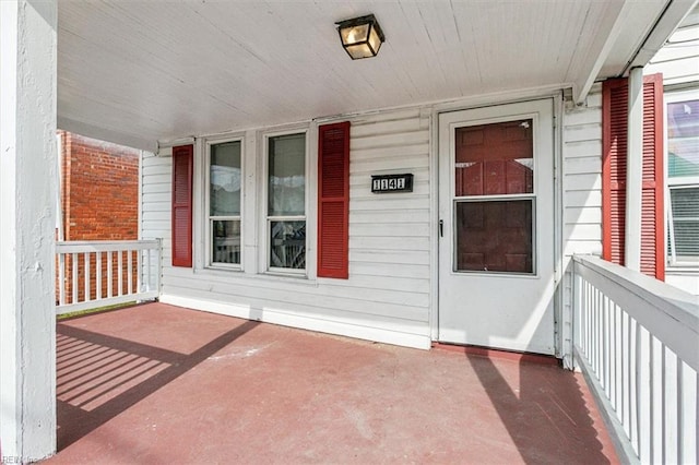 doorway to property featuring a porch