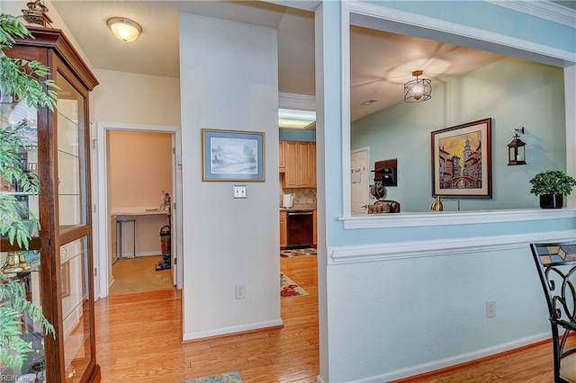 interior space featuring wood finished floors and baseboards