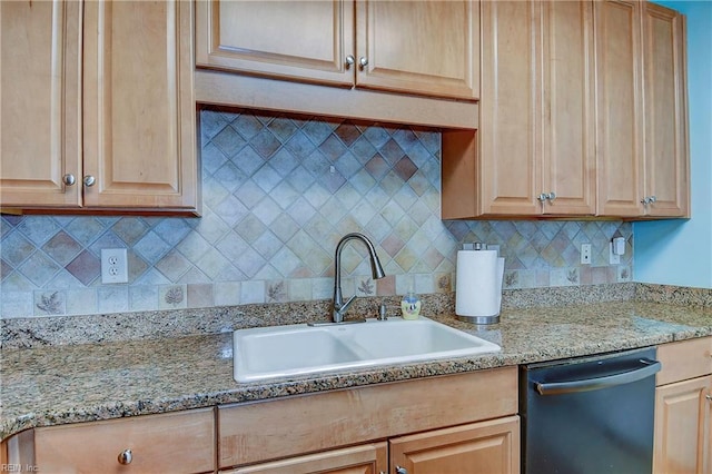 kitchen featuring light brown cabinets, a sink, backsplash, and dishwashing machine