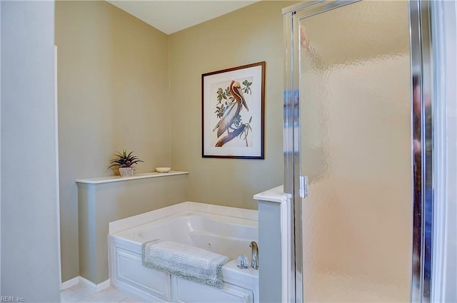 bathroom with a whirlpool tub, a stall shower, and baseboards