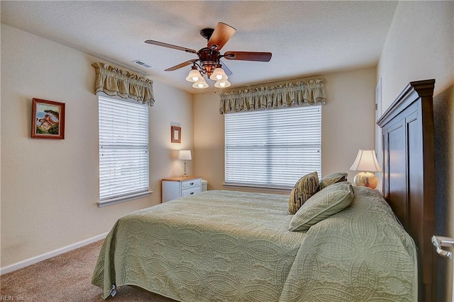 bedroom with carpet, ceiling fan, and baseboards