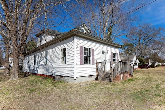 exterior space featuring a front yard and crawl space