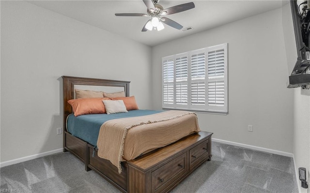 carpeted bedroom featuring visible vents, ceiling fan, and baseboards