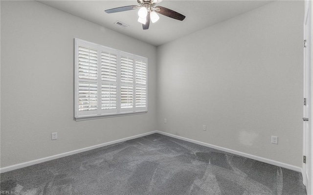 unfurnished room featuring a ceiling fan, baseboards, visible vents, and carpet flooring