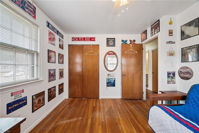 bedroom featuring a ceiling fan and wood finished floors