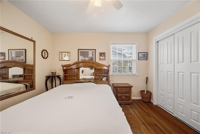 bedroom with a closet, dark wood-style flooring, baseboards, and a ceiling fan