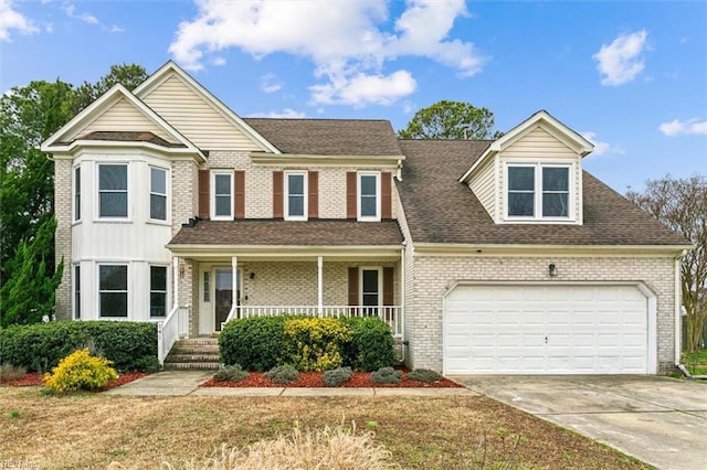 view of front facade featuring a garage, driveway, a shingled roof, a porch, and brick siding