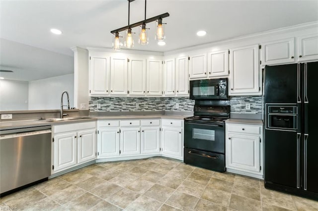 kitchen with black appliances, tasteful backsplash, a sink, and white cabinets