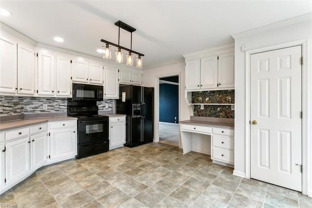 kitchen featuring black appliances, crown molding, white cabinets, and built in desk