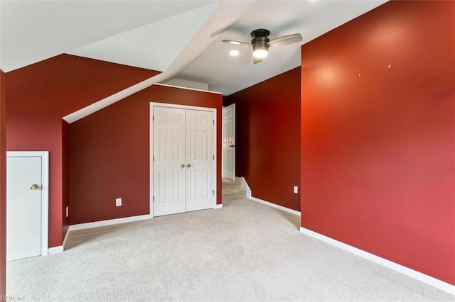 bonus room with carpet, baseboards, vaulted ceiling, and a ceiling fan