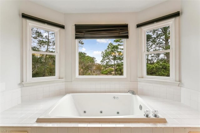 bathroom featuring a tub with jets