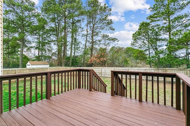 deck featuring a fenced backyard and a yard