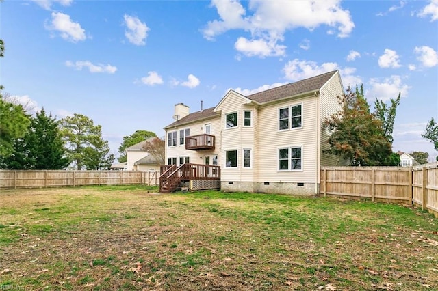 back of property featuring a fenced backyard, a chimney, crawl space, a deck, and a yard