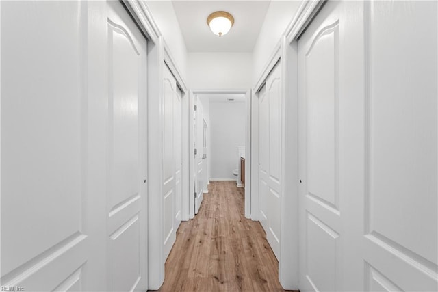 hallway featuring light wood-style flooring