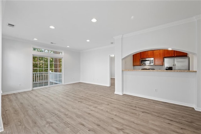 unfurnished living room featuring light wood finished floors, baseboards, and crown molding