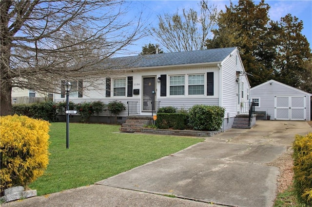 view of front facade with an outbuilding, a front lawn, a detached garage, a shingled roof, and crawl space