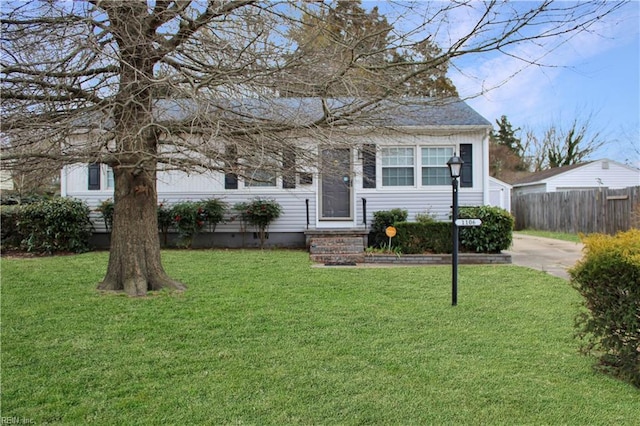 view of front of home featuring crawl space, a front yard, and fence