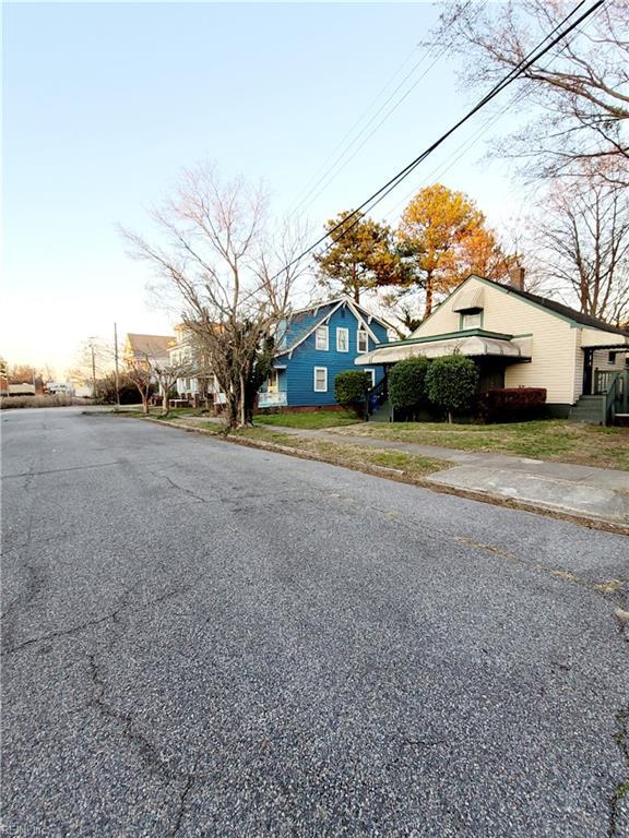 view of road with sidewalks and a residential view