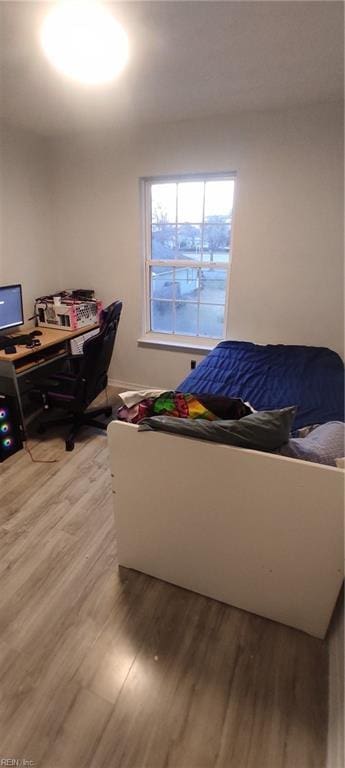 bedroom featuring light wood-style floors