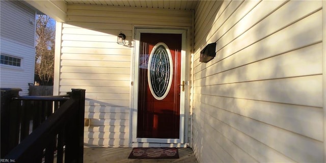 entrance to property featuring fence