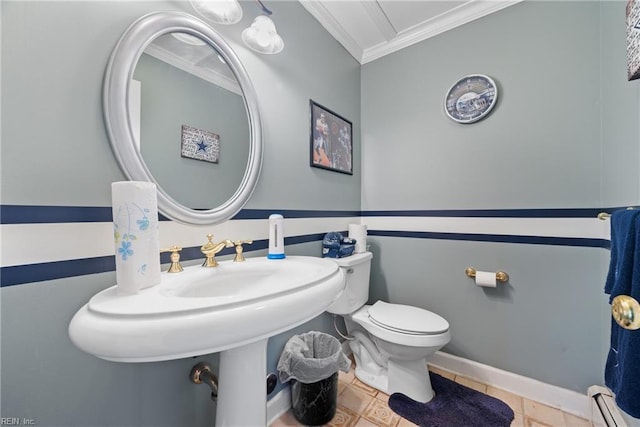 bathroom with a baseboard heating unit, crown molding, baseboards, toilet, and tile patterned floors