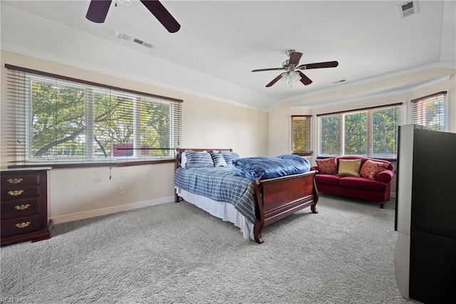 bedroom featuring visible vents, crown molding, carpet flooring, and vaulted ceiling