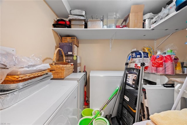 washroom with laundry area and washer and dryer