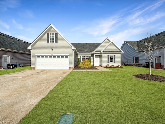 view of front of property featuring a garage, driveway, and a front lawn