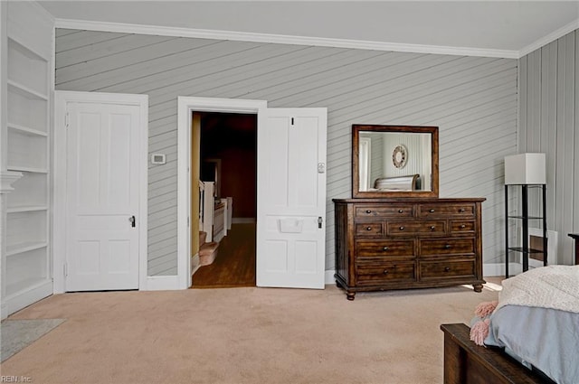 carpeted bedroom featuring ornamental molding