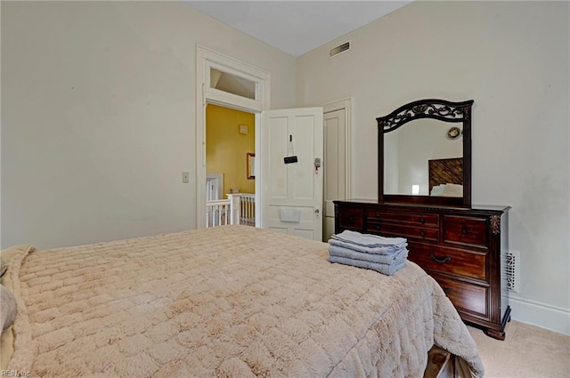 bedroom featuring carpet, visible vents, and baseboards