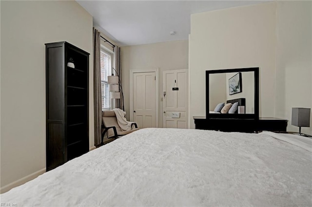 bedroom featuring baseboards